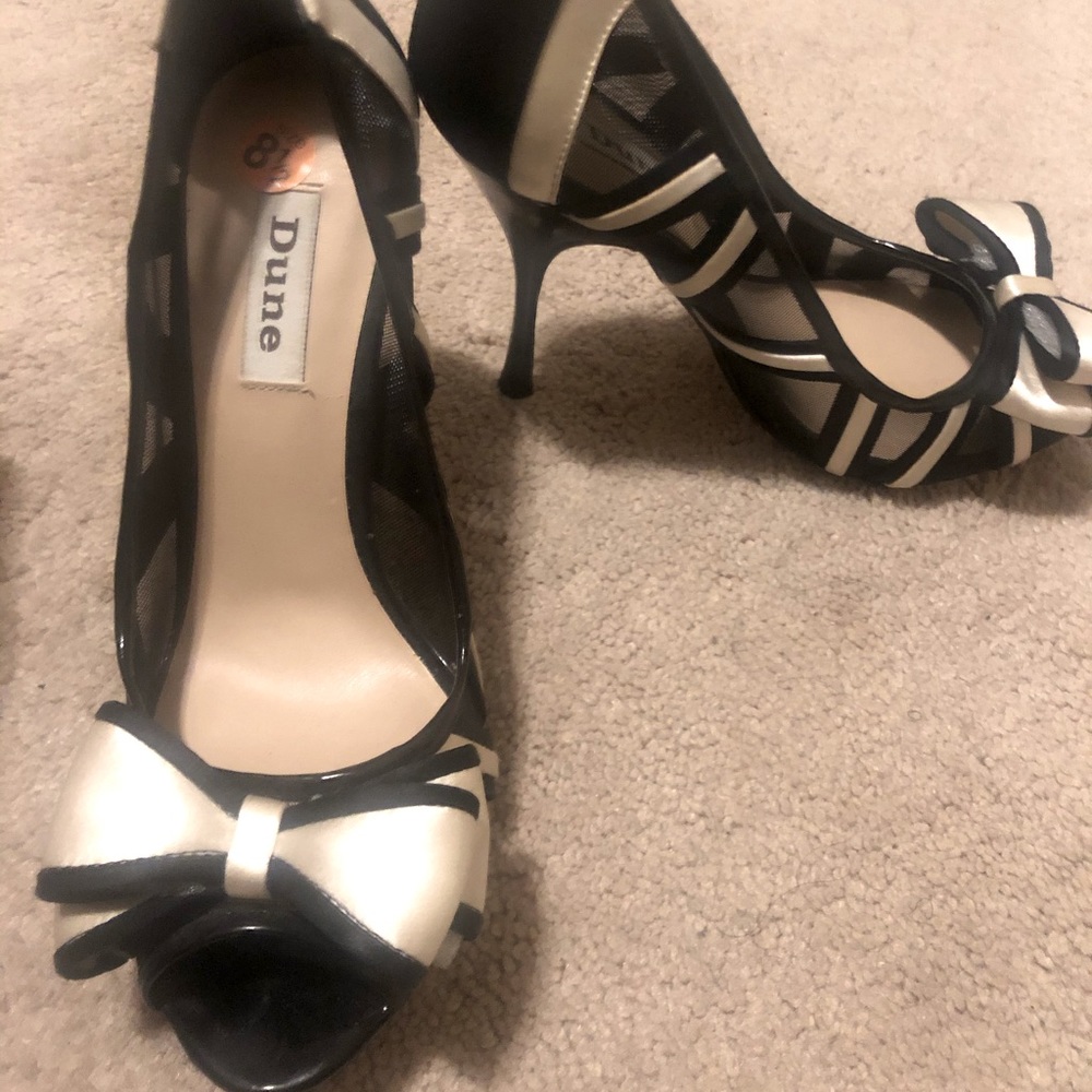 Size 8.5 Dune Black Heels w/ cream satin lining.